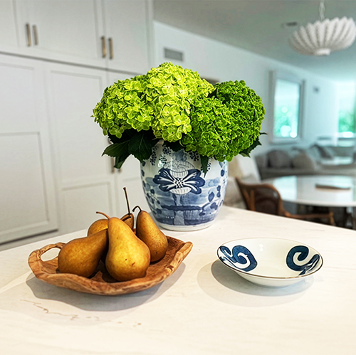 Hydrangeas and pears styled on a kitchen island