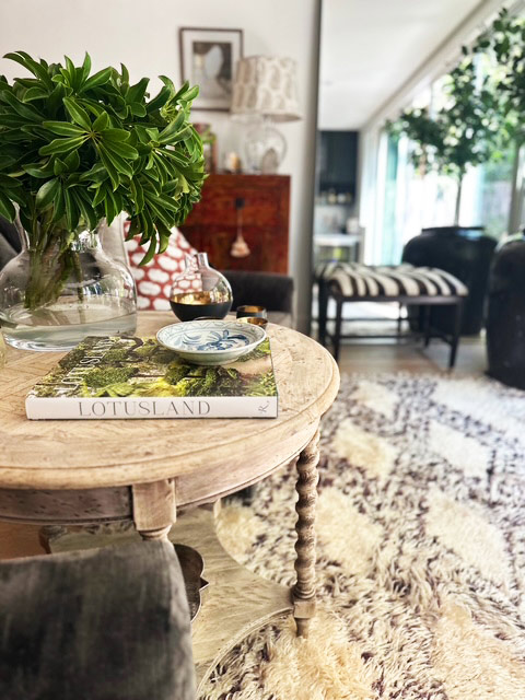 Greenery and collected objects on a round table