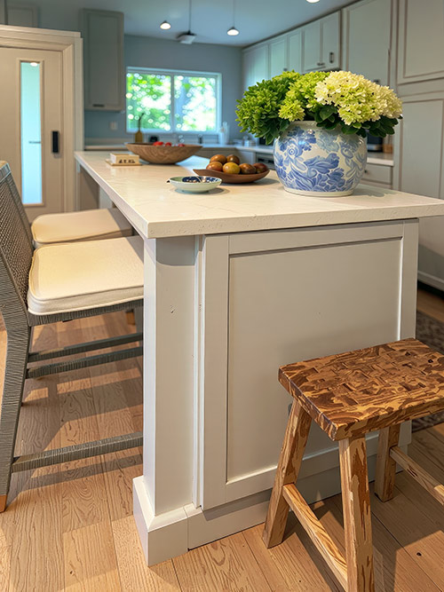 Hydrangeas and collected objects in a bright kitchen