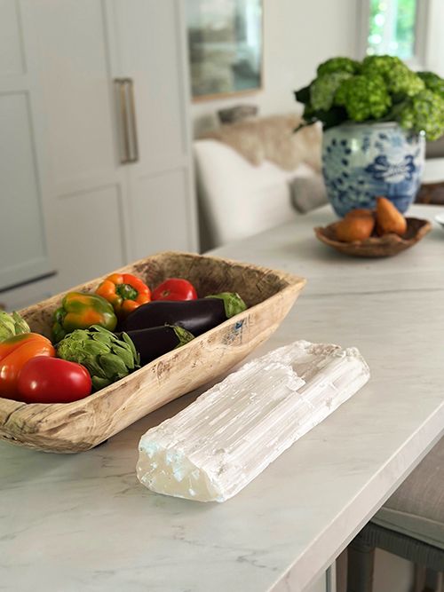 Fresh produce and hydrangeas styled on a kitchen counter