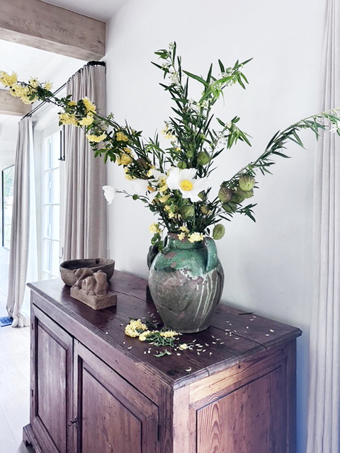 Floral arrangement on an antique console