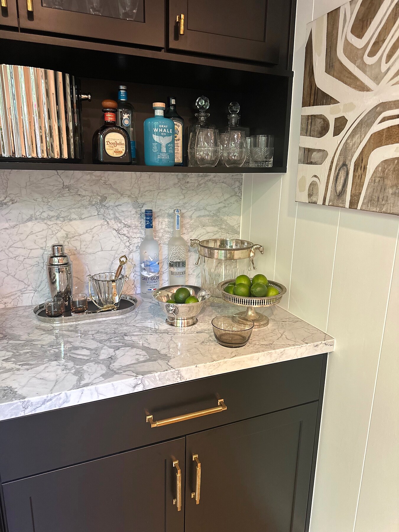 Styled home bar with marble, brass and fresh limes