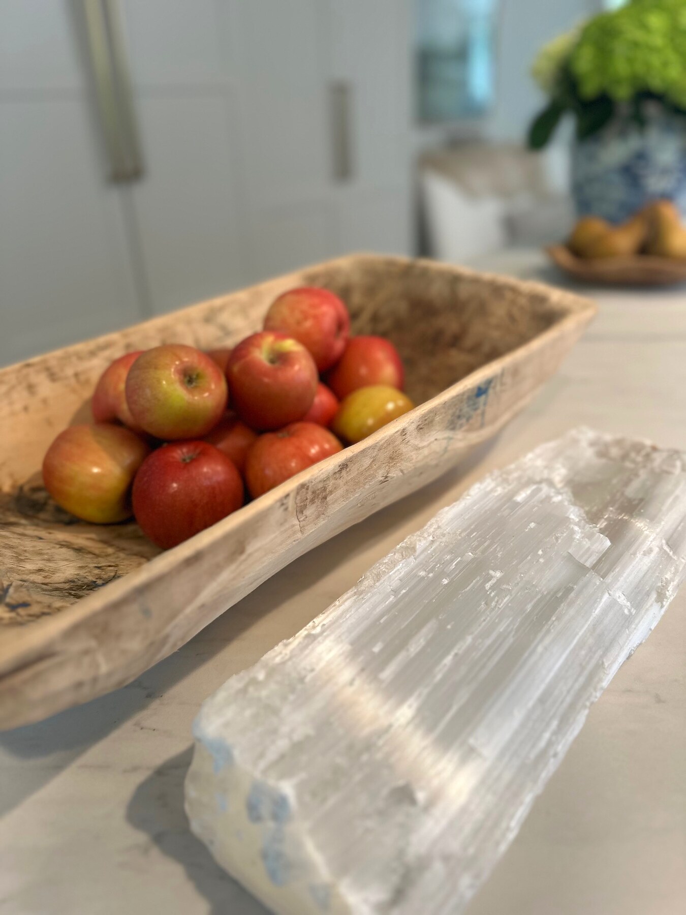 Apples and crystal styling detail on a kitchen counter